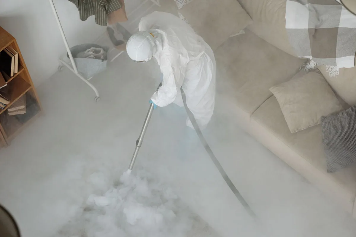 Biohazard cleanup technician in protective equipment, Whitehall, PA